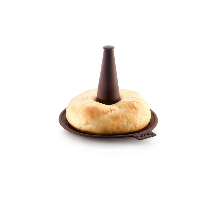 Bagel on a brown stand with a white background
