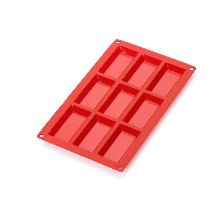Red silicone mold with six rectangular cavities on a white background
