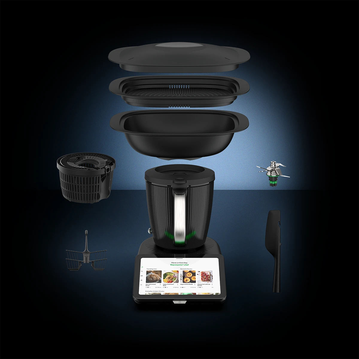 All-in-one cooker with various components on a dark background